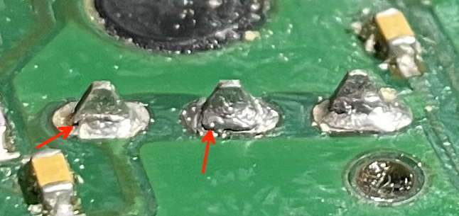 fractured solder joints, marked with red arrows