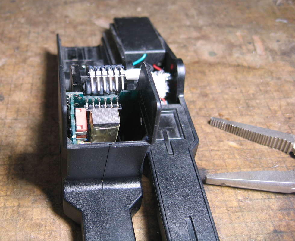 plug section (“male”, pins) of visible connector unplugged, hovering over socket