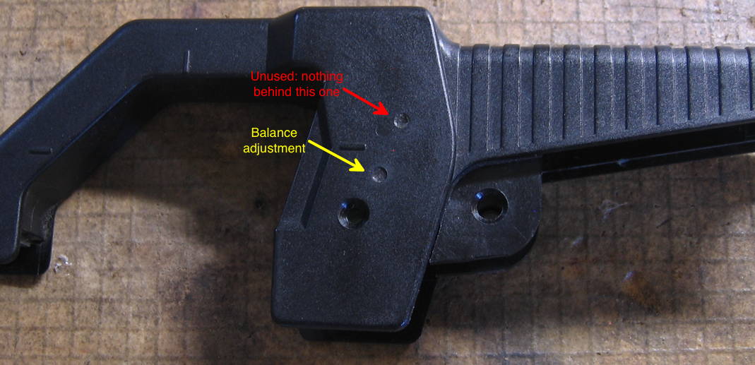 Hole nearest the screw hole is the only active one, for Hall balance. Other hole is unused.